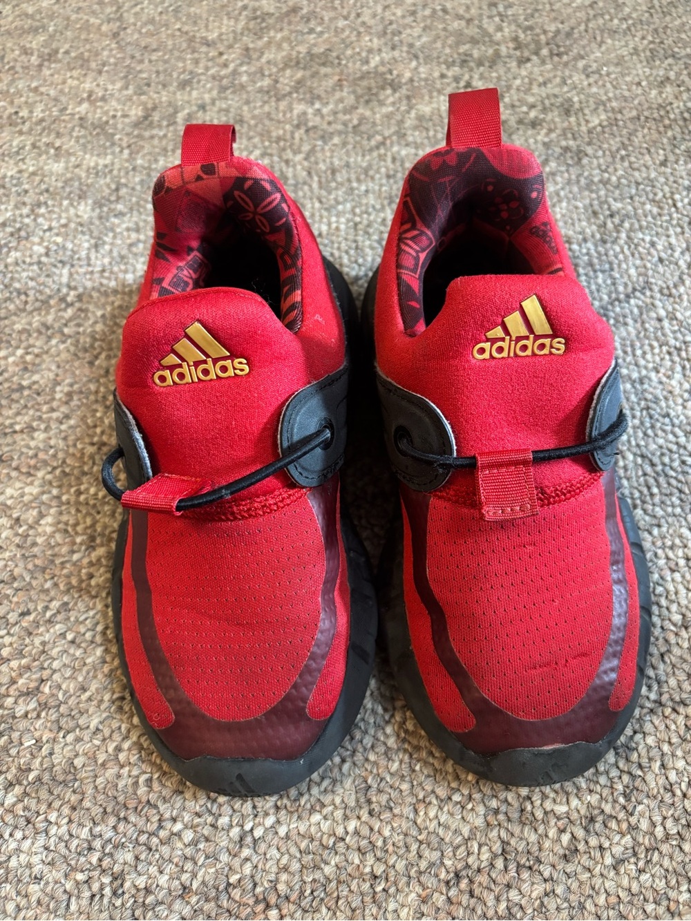 adidas Kids Red and Black Slip-On Sneakers with Gold Logo
